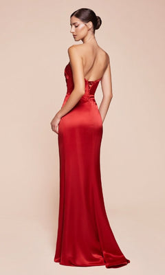 Woman models the Simple Strapless Long Prom Dress: Ladivine 7451, a floor-length red satin gown, standing with her back slightly turned against a plain light background, showcasing its elegant design.