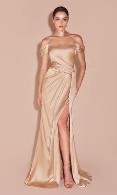 A woman wearing the Lace-Up Off-Shoulder Prom Dress:  Ladivine 7452 in beige, featuring a thigh-high slit, stands against a matching background and pairs the dress with high-heeled sandals.