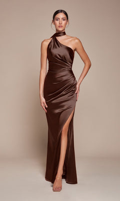 A woman models the Ladivine 7454 One-Shoulder Sash Long Prom Dress in brown satin, showcasing a thigh-high slit, while standing against a plain beige background.