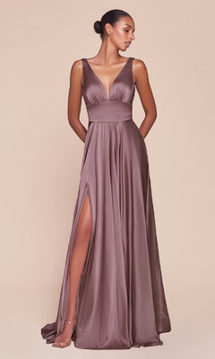 A woman in the Ladivine 7469 Sleeveless Classic Long Prom Dress with a deep V-neckline and thigh-high slit poses against a plain beige background.