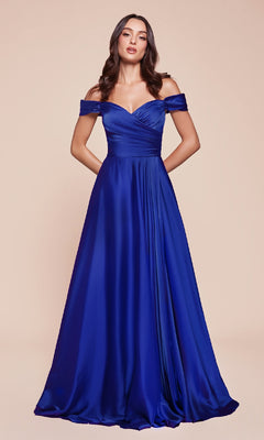 A woman models the Ladivine 7493-1, an off-the-shoulder long prom dress in royal blue with pockets, standing elegantly against a neutral background.