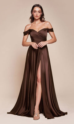 A woman poses in a studio wearing the Classic Off-Shoulder Long A-Line Prom Dress 7493 in Espresso, featuring a floor-length satin silhouette with a high slit, paired with strappy heels.