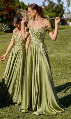 Two women stand on grass in matching Ladivine 7493-1 Off-the-Shoulder Long Prom Dresses in olive green; one holds a golf club over her shoulders, and both look downwards.