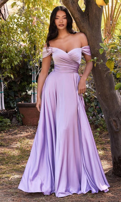 A woman stands outdoors in the Ladivine 7493-1 Off-the-Shoulder Long Prom Dress, featuring a fitted bodice and flowing A-line skirt—perfect as an evening gown.