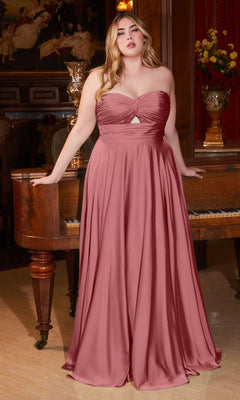 A woman wearing the Plus-Size Strapless Sweetheart Prom Dress 7496C stands before a wooden piano in an elegant room, radiating timeless charm.