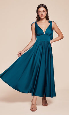 A woman models the Ladivine 7499 Tea-Length Wedding-Guest Dress—a teal sleeveless A-line midi dress with a deep V-neckline, tie straps, and a flowing skirt—standing against a neutral background.