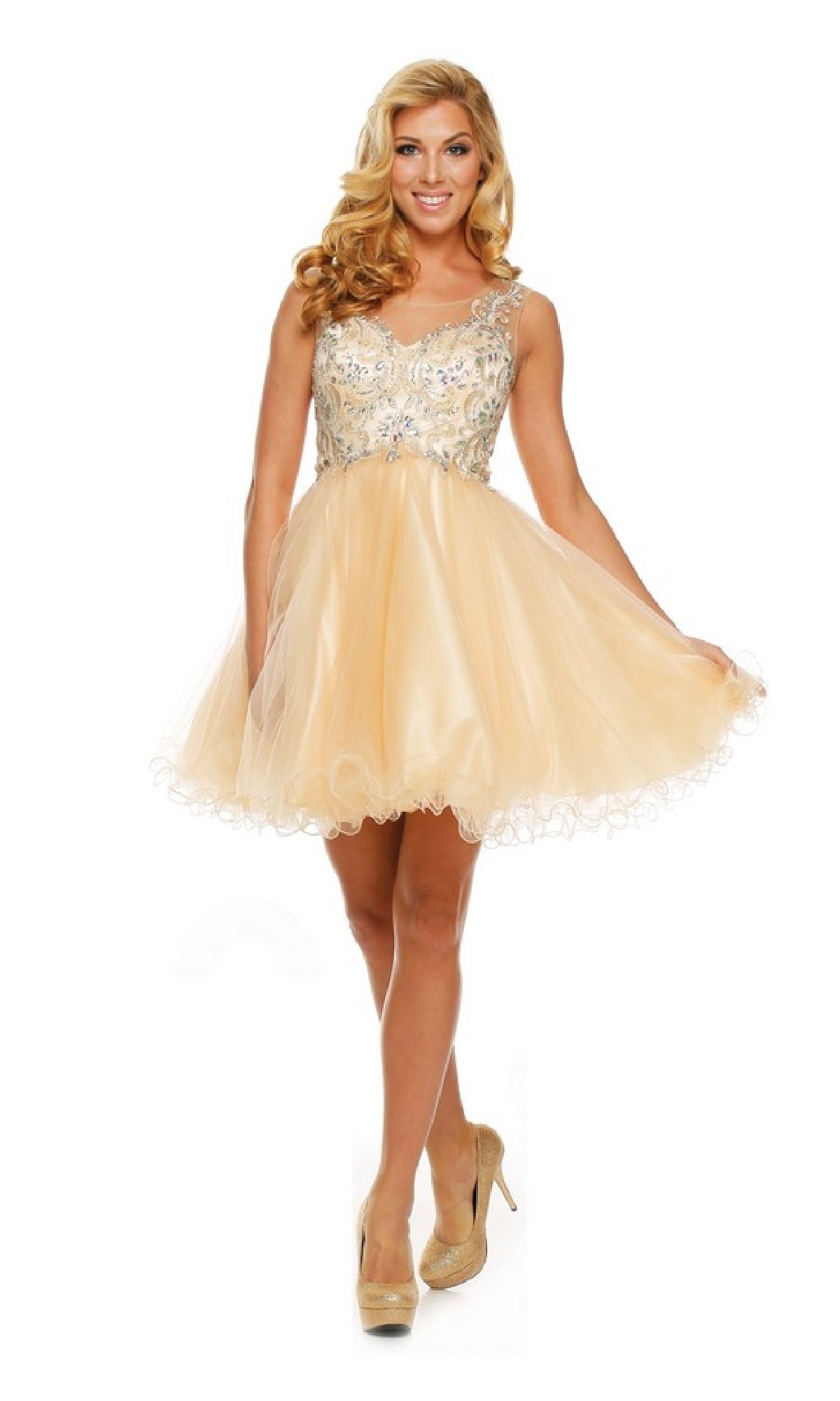 A woman in the Short Hoco Dress: Juliet 749, featuring a peach hue, embellished bodice, and flirty A-line tulle skirt, stands holding the skirt out to the side.