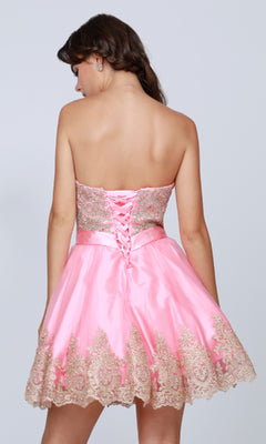 A woman facing away from the camera wears the Short Hoco Dress: Juliet 759, featuring a strapless neckline, gold embroidery, an a-line skirt, and lace-up back detail.