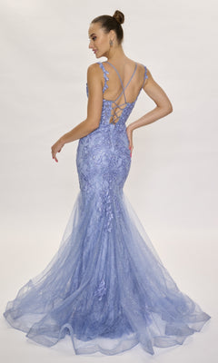 A woman wearing the Lace Mermaid Prom Dress: Nina Canacci 7600—a fitted, floor-length, light purple lace gown with floral accents and a lace-up back—stands on a white background.