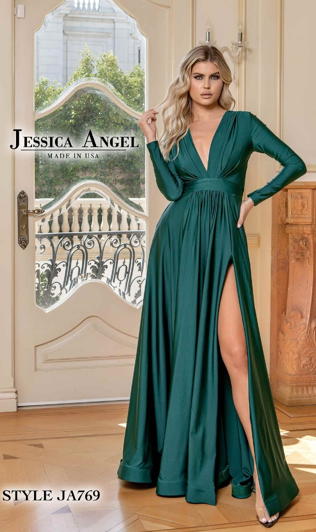 A woman in a floor-length emerald green formal dress with long sleeves, deep V-neckline, and thigh-high slit stands by a glass door. Text reads 