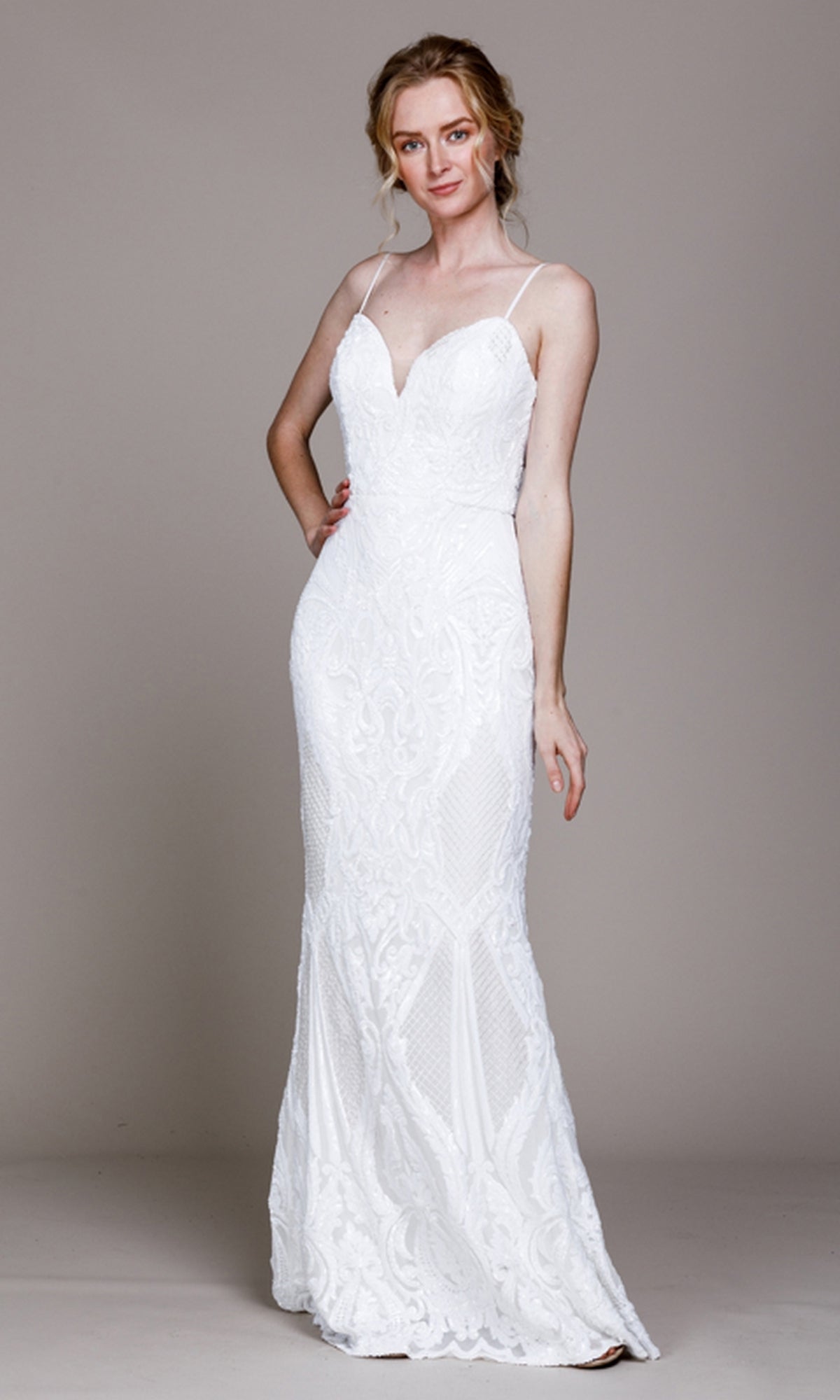 A woman models the Sequin-Print Sleek Long Prom Dress 791 with a fitted silhouette, thin straps, sweetheart neckline, and subtle deep v-back, posing against a plain background.