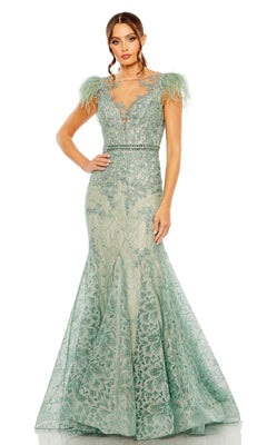 Woman in a floor-length mint green "Feathered Long Lace Formal Dress: Mac Duggal 79230" with feathered shoulders and floral lace, standing against a white background.