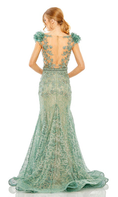 Woman wearing the Mac Duggal 79368 Cap-Sleeve Long Formal Dress—fitted, green lace with floral details, sheer back panel, and her hair in a low ponytail.