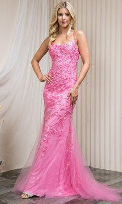 A woman stands indoors wearing the Embroidered-Lace Tight Long Prom Gown 799—a fitted, floor-length pink dress with floral lace detailing and tulle overlay, exuding elegant evening style.