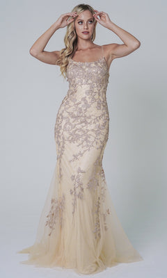 A woman models the Embroidered-Lace Tight Long Prom Gown 799—this sleeveless, beige, floor-length dress features floral embroidery and lace detailing, shown against a plain light background.