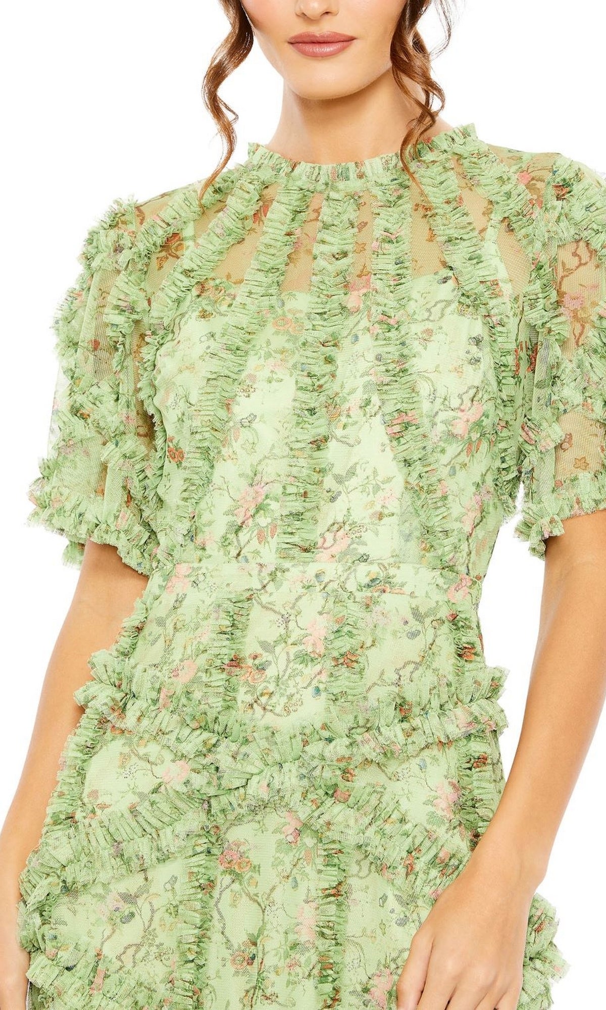 Woman shown from shoulder to mid-thigh wearing the Mac Duggal 8010 Short-Sleeve Wedding-Guest Dress in light green with floral print, sheer panels, and ruffled trim.