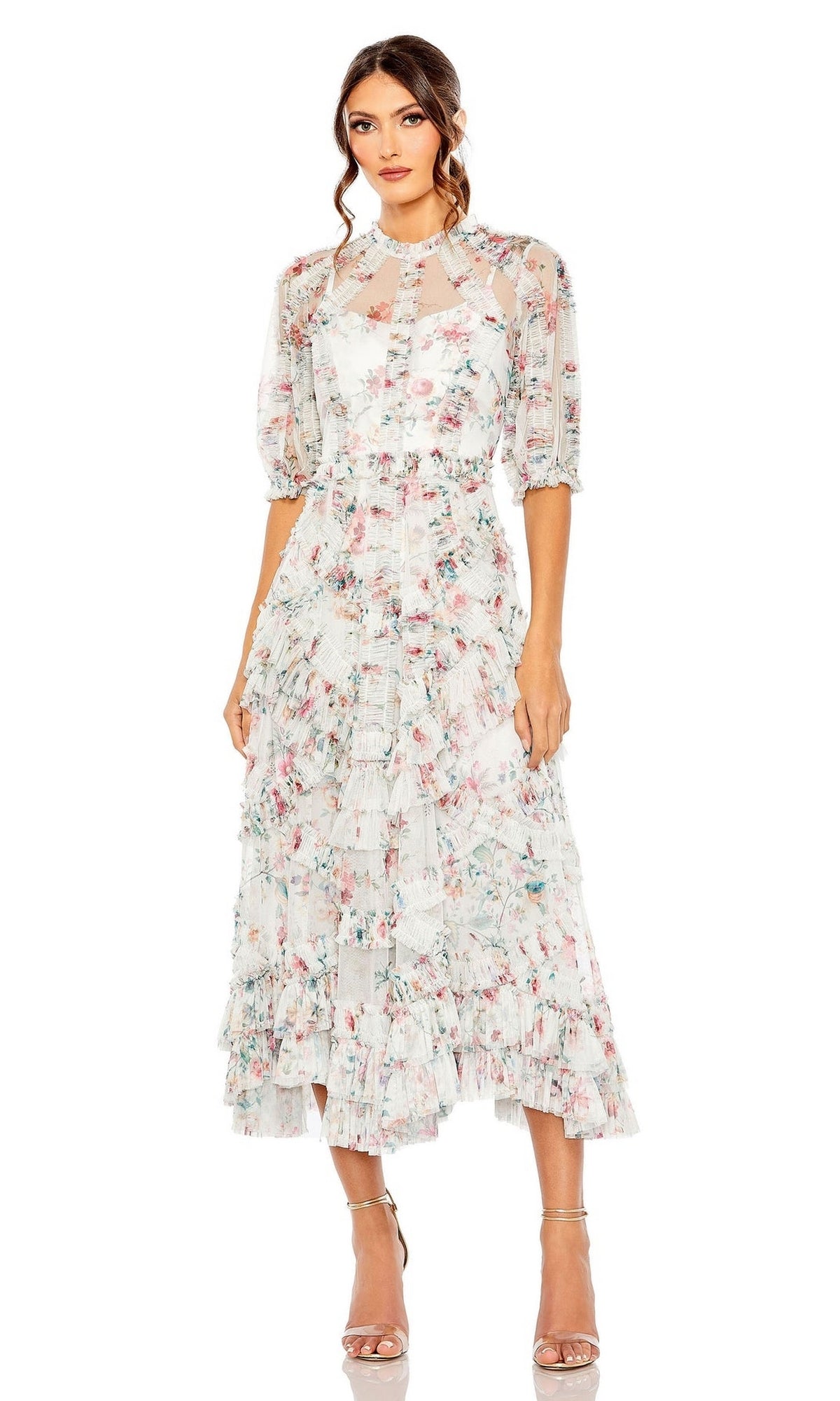 Woman wearing the Mac Duggal 80111 Short Sleeve Wedding Guest Dress with tiered ruffles and strappy heels, standing against a white background.