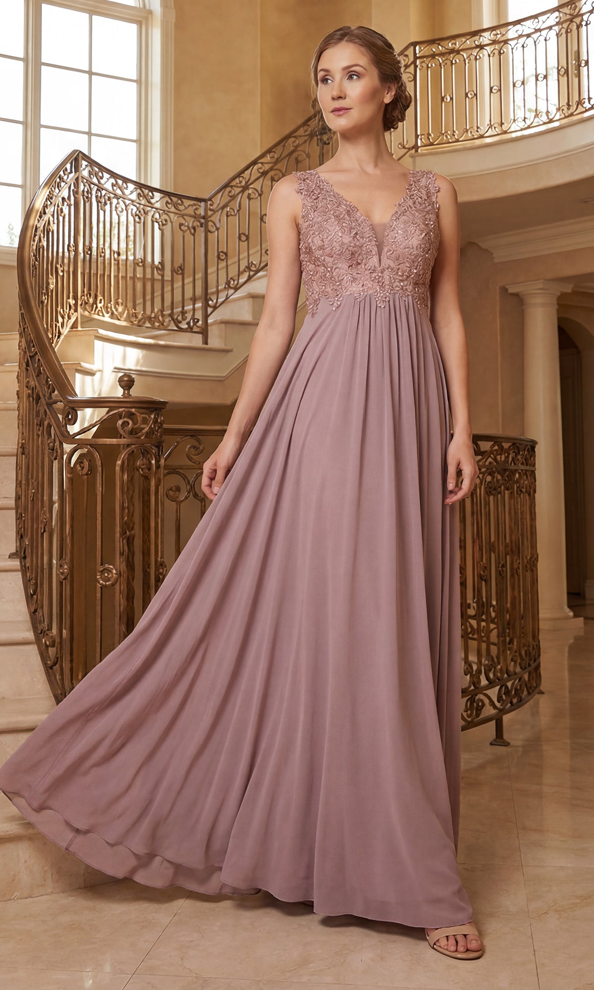 A woman in a mauve Sleeveless V-Neck Chiffon Long Prom Dress 8012 with a lace bodice and flowing skirt stands on a marble staircase with ornate railings in a bright, elegant interior.