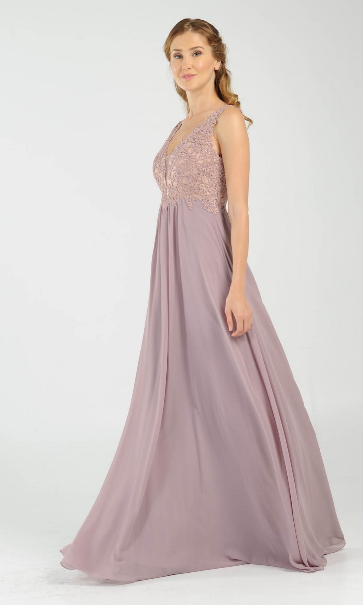 A woman wears the Sleeveless V-Neck Chiffon Long Prom Dress 8012, featuring a lace bodice and flowing skirt, against a plain light background.