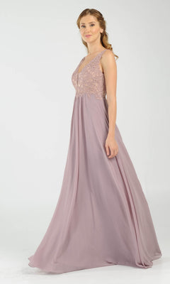A woman wears the Sleeveless V-Neck Chiffon Long Prom Dress 8012, featuring a lace bodice and flowing skirt, against a plain light background.