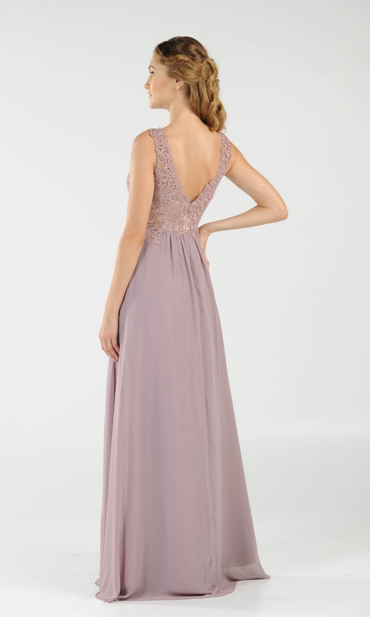 A woman faces away, wearing the Sleeveless V-Neck Chiffon Long Prom Dress 8012 featuring a mauve A-line skirt and lace V-back bodice, set against a plain light background.
