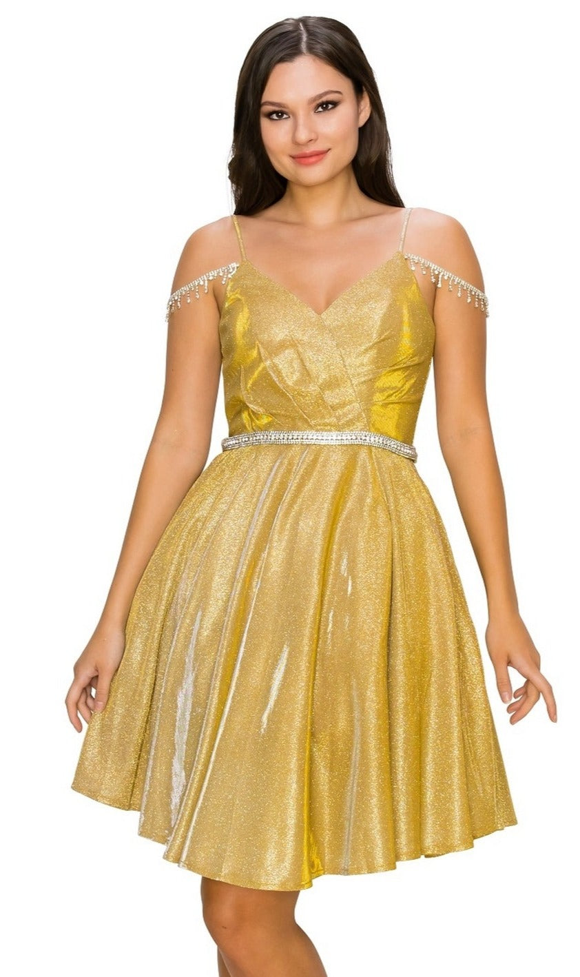 A woman stands against a white background wearing the Beaded Cold-Shoulder Short Homecoming Dress 8014J, featuring a gold shimmer, V-neckline, off-shoulder beaded straps, and a jeweled waist belt.