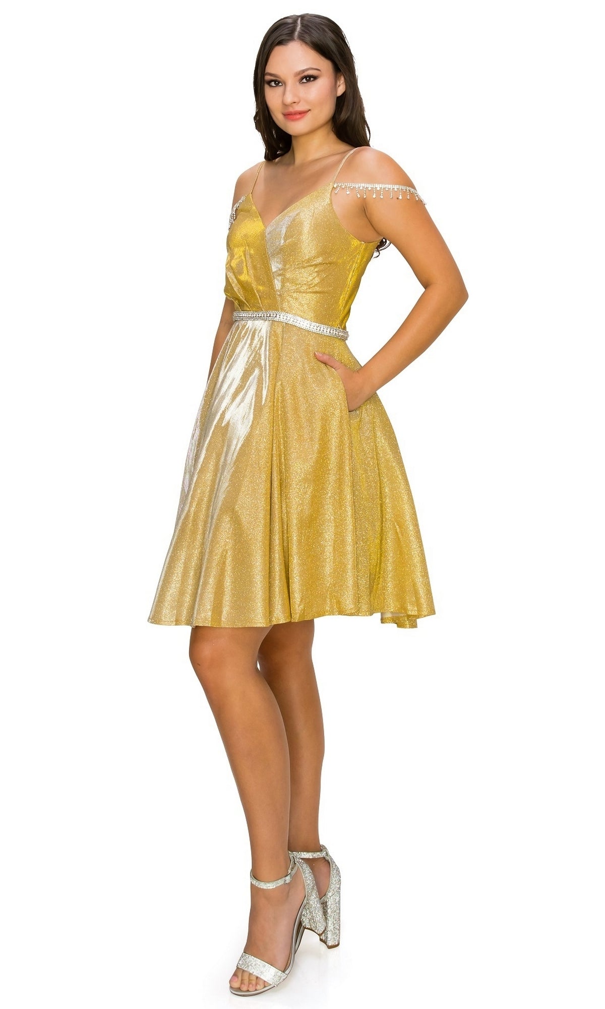 Woman wearing the Beaded Cold-Shoulder Short Homecoming Dress 8014J, featuring rhinestone accents and silver high heels, standing and smiling against a white background.