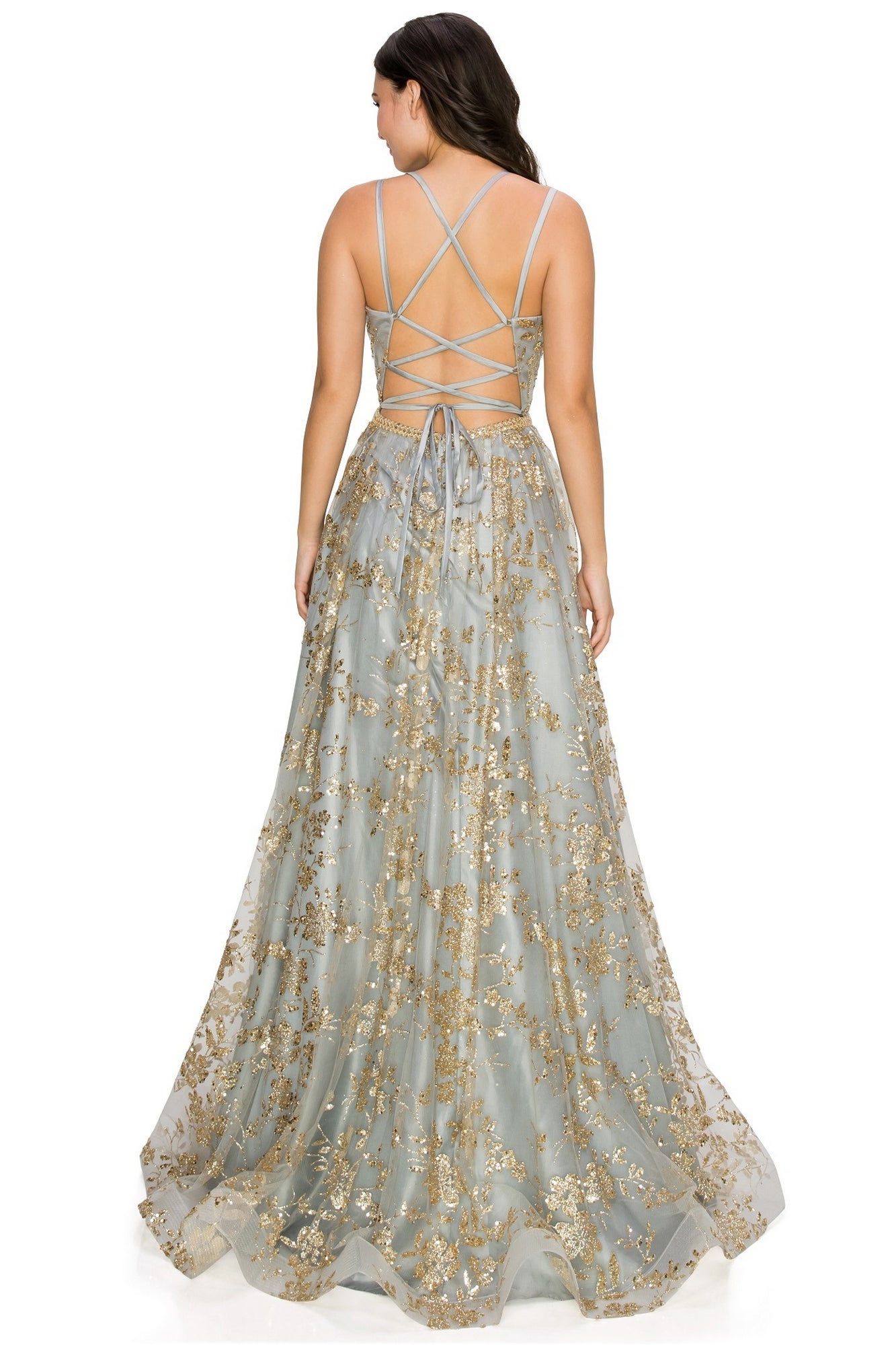 A woman faces away in the Floral-Glitter Long A-Line Formal Prom Dress 8022J, a light blue gown with gold embroidery, floral glitter details, and crisscrossed straps across an open back—perfect for prom.