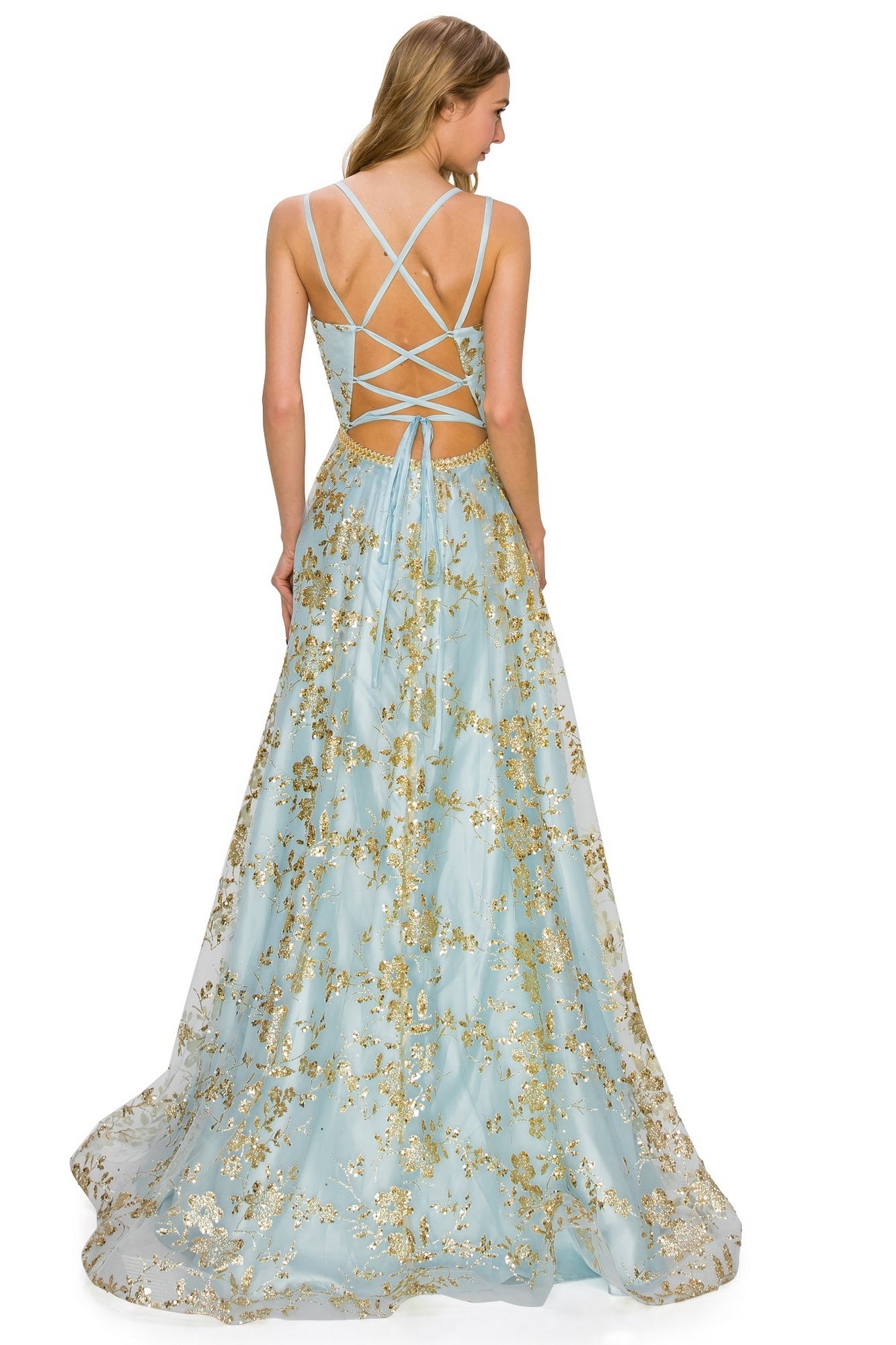 A woman in the Floral-Glitter Long A-Line Formal Prom Dress 8022J, a light blue gown with gold patterns and a strappy open back, stands facing away from the camera in this elegant formal look.
