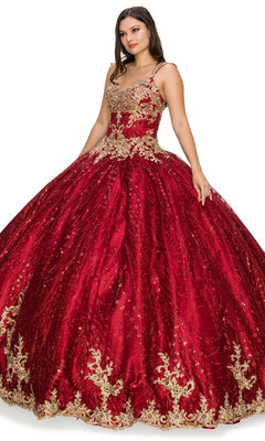 A woman stands against a white background wearing the Quinceanera Ball Gown 8024J in red, featuring gold lace embroidery and a full, voluminous skirt.