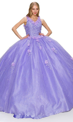A woman in the Quinceanera Ball Gown 8025J—a sleeveless, floor-length lavender dress with floral embroidery and a voluminous glitter tulle skirt.