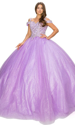 A woman poses against a white background wearing the Quinceanera Ball Gown 8028J, a sparkling lavender glitter tulle dress with off-the-shoulder straps and intricate silver embellishments.