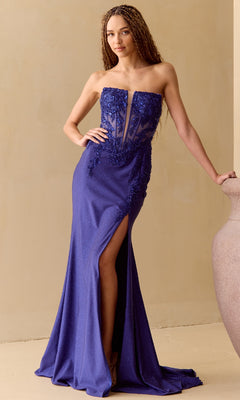 A woman stands beside a large vase wearing the Amelia Couture 8040 Long Glitter Prom Dress, a strapless royal blue gown with a corset bodice, beaded details, high slit, and mermaid skirt.