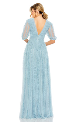 Woman wearing the Long Formal Dress 8050 by Mac Duggal—a light blue, floor-length A-line gown with sheer puff sleeves and a deep V-back—standing and facing away from the camera.