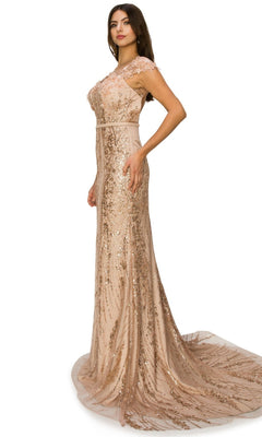 A woman stands in profile against a white background, wearing the floor-length Cinderella Couture 8057J Long Glitter Prom Dress in blush pink with off-the-shoulder design, sequin embellishments, and a small train.