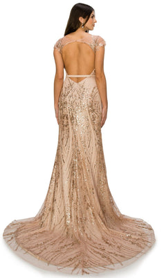 Woman wearing the Long Glitter Prom Dress: Cinderella Couture 8057J, a floor-length nude gown with gold sequins, cap sleeves, open back, and sweeping train, standing and facing away from the camera.