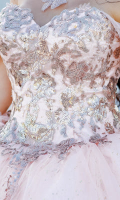 Close-up of Quinceanera Ball Gown 8064J: a pink off-the-shoulder dress with silver sequin floral embroidery and tulle fabric.