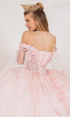 A woman is shown from behind wearing a crown and the Cinderella Couture 8075J quinceanera dress, featuring an off-the-shoulder design, lace-up back, and floral 3D appliques.
