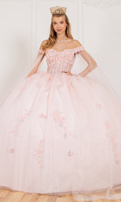 A woman in the Cinderella Couture 8075J quinceanera dress, an off-the-shoulder sparkly light pink gown with floral 3D appliques and a crown, stands against a plain white background.