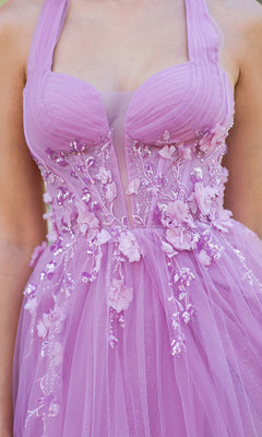 A close-up of a person wearing the Cinderella Couture 8076J, a long halter prom dress in lavender with sheer panels, floral appliqués, and glitter details on the bodice and skirt.