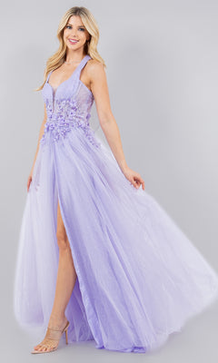 A woman poses and smiles against a light background in the Cinderella Couture 8076J long halter prom dress, featuring a sleeveless floor-length lavender design with floral appliqués and a high slit.