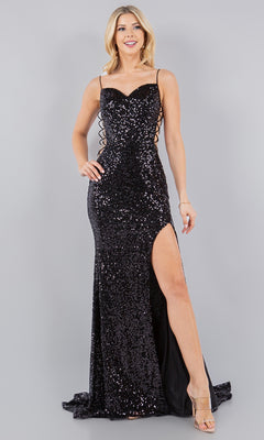 A woman models the Sparkly Sequin Prom Dress: Cinderella Couture 8078J, featuring spaghetti straps, lace-up sides, a high slit, and open back, styled with clear-heeled shoes against a plain background.