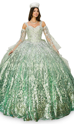 A woman smiles while wearing the Quinceanera Ball Gown 8080J, a sparkling light green dress with silver patterns, matching gloves, necklace, and jeweled crown.