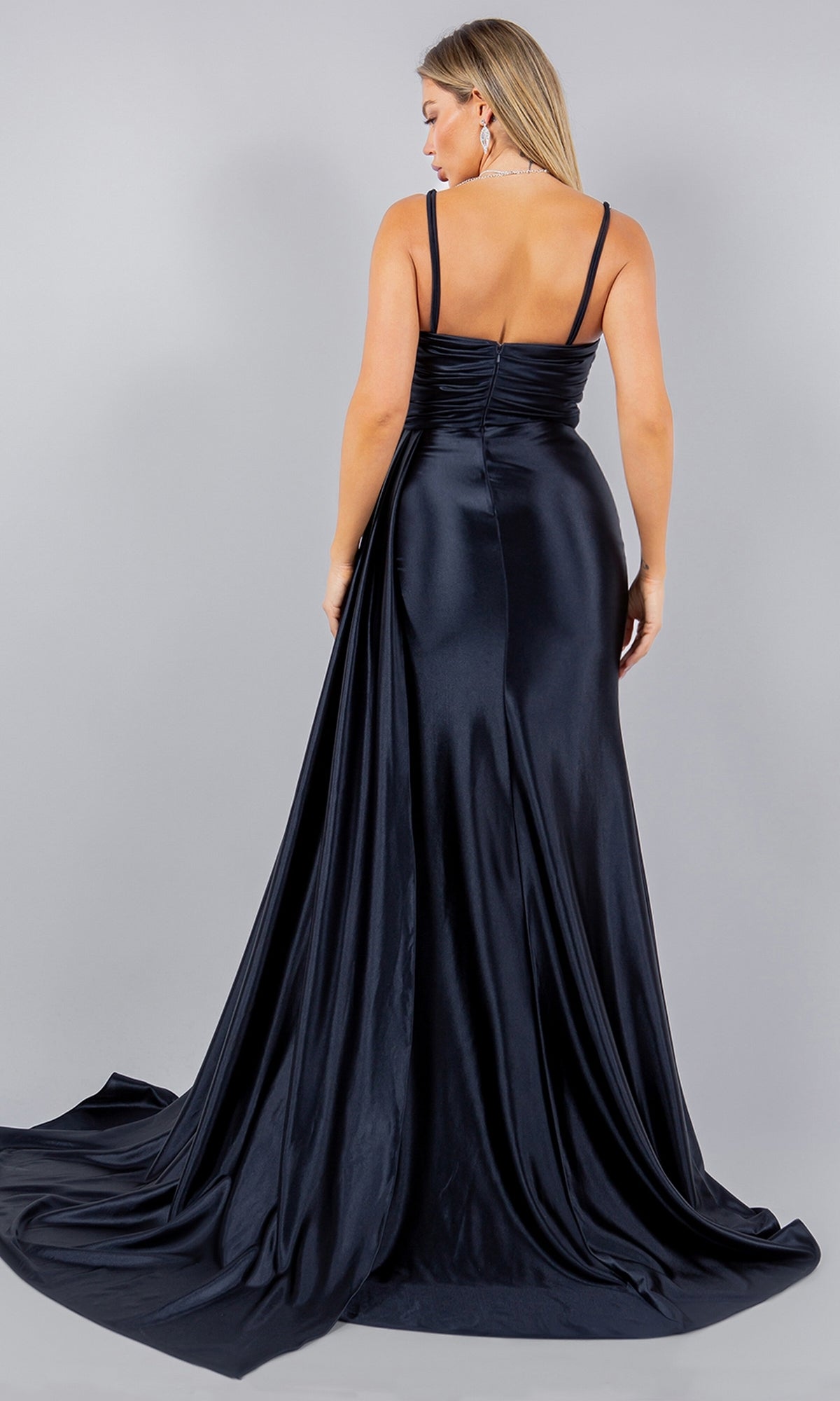 Woman wearing the Strapless Satin Prom Dress, Cinderella Couture 8082J, standing with her back to the camera against a plain gray background.