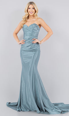 A woman models the Cinderella Couture 8083J satin mermaid prom dress in metallic blue, posing against a plain light grey background.