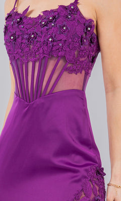 A close-up of the Long Corset Prom Dress: Cinderella Couture 8085J in purple, featuring floral lace, beaded embroidery, and sheer mesh panels, shown worn with a bracelet.