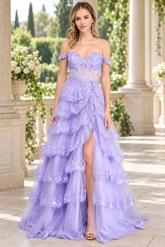 Amelia Couture 8085 lavender off-shoulder tiered ball gown with a corset bodice, lace appliques, and a high leg slit.