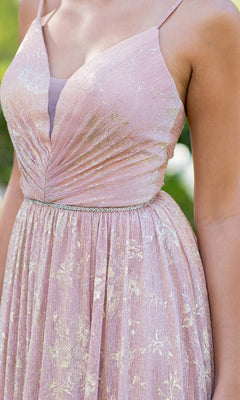 A close-up of a person wearing the Cinderella Couture 8086J blush pink prom dress, featuring a floral print, metallic patterns, and a ruched bodice, shown from shoulders to waist.