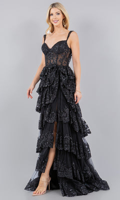 A woman models the Cinderella Couture 8093J Ruffled Tiered Prom Dress, featuring a sleeveless black design with lace, sequins, and glitter details, set against a plain gray background.