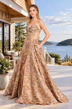 Amelia Couture 8098 strapless, floor-length floral prom dress with a crystal-embellished corset bodice, an embroidered skirt, and a high side slit.